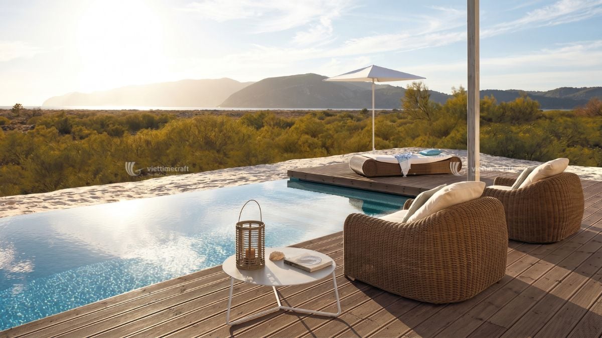 Luxury resort patio furnished with premium wicker sofas and lounge chairs