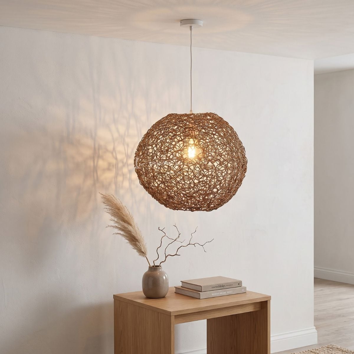 Artisanal nest-style woven rattan lamp shade diffusing soft ambient light through an open mesh design