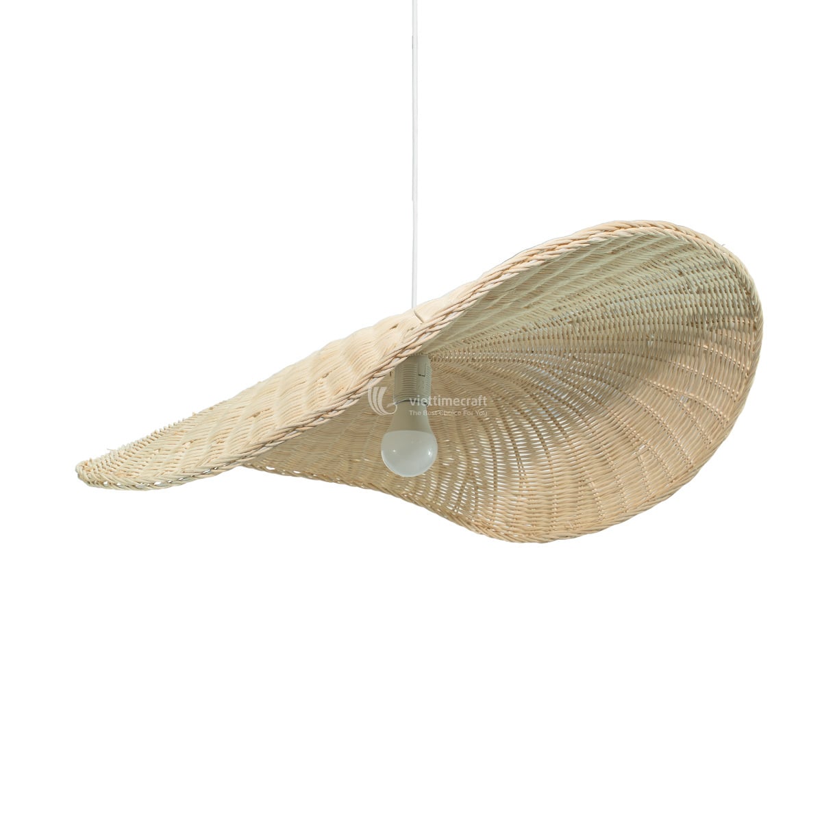Large wavy rattan pendant lamp hanging over dining table in modern hotel resort